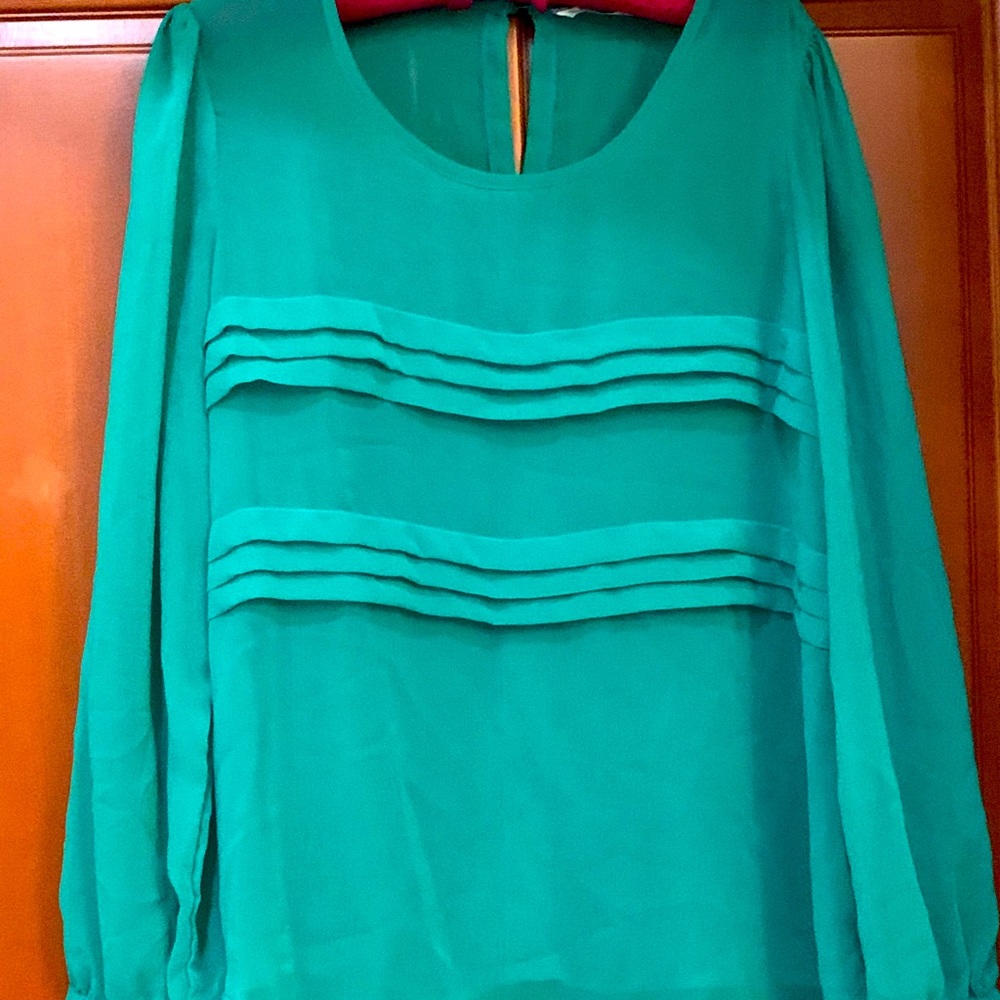 Green blouse with ruffles